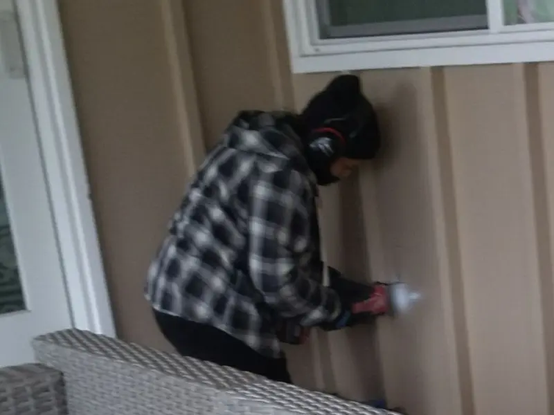 Professional electrician installing an exterior outlet in Oak Ridge